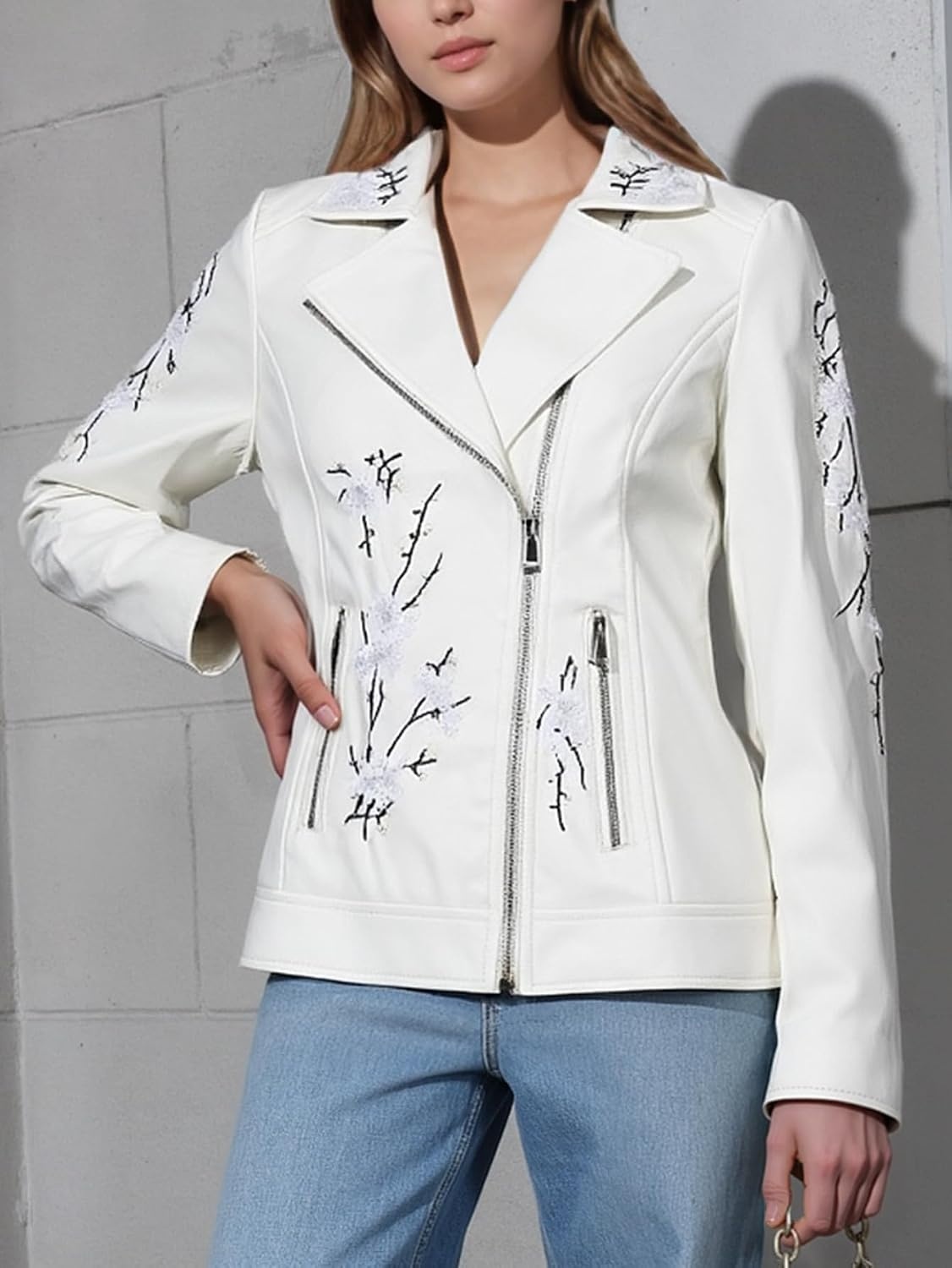 image:imageBellivera Womens Faux Leather Jacket Floral Lightweight Moto Coat Embroidered Casual Biker Slim Fit Outwear for Spring Fall with Pockets Notch Lapel and Asymmetric Front ZipperWhite